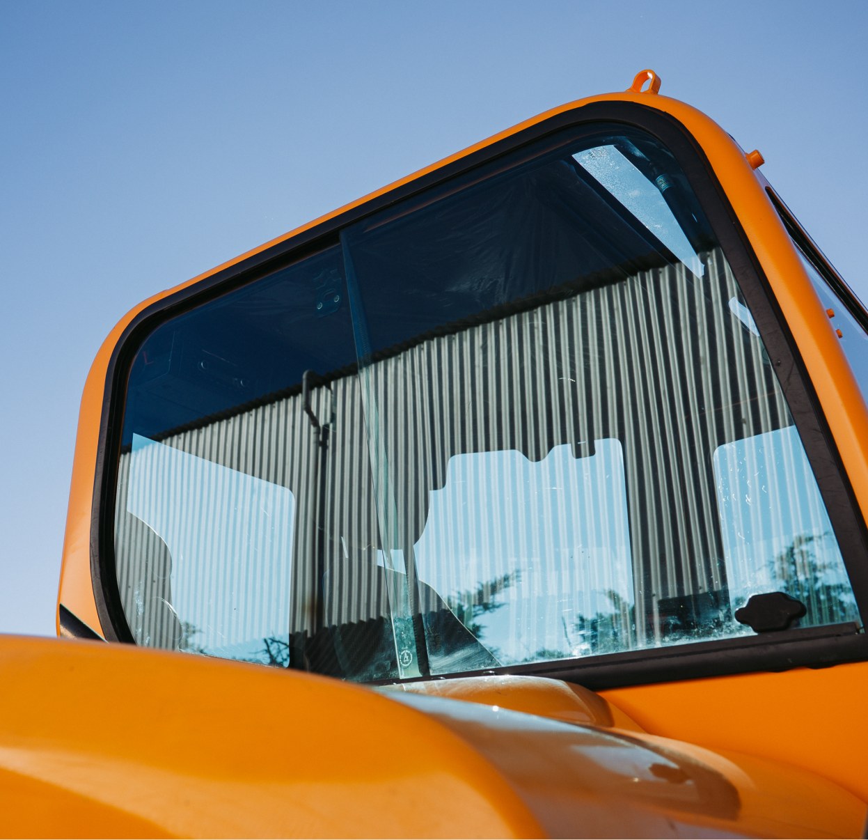 Close-up of vehicle glass being fitted