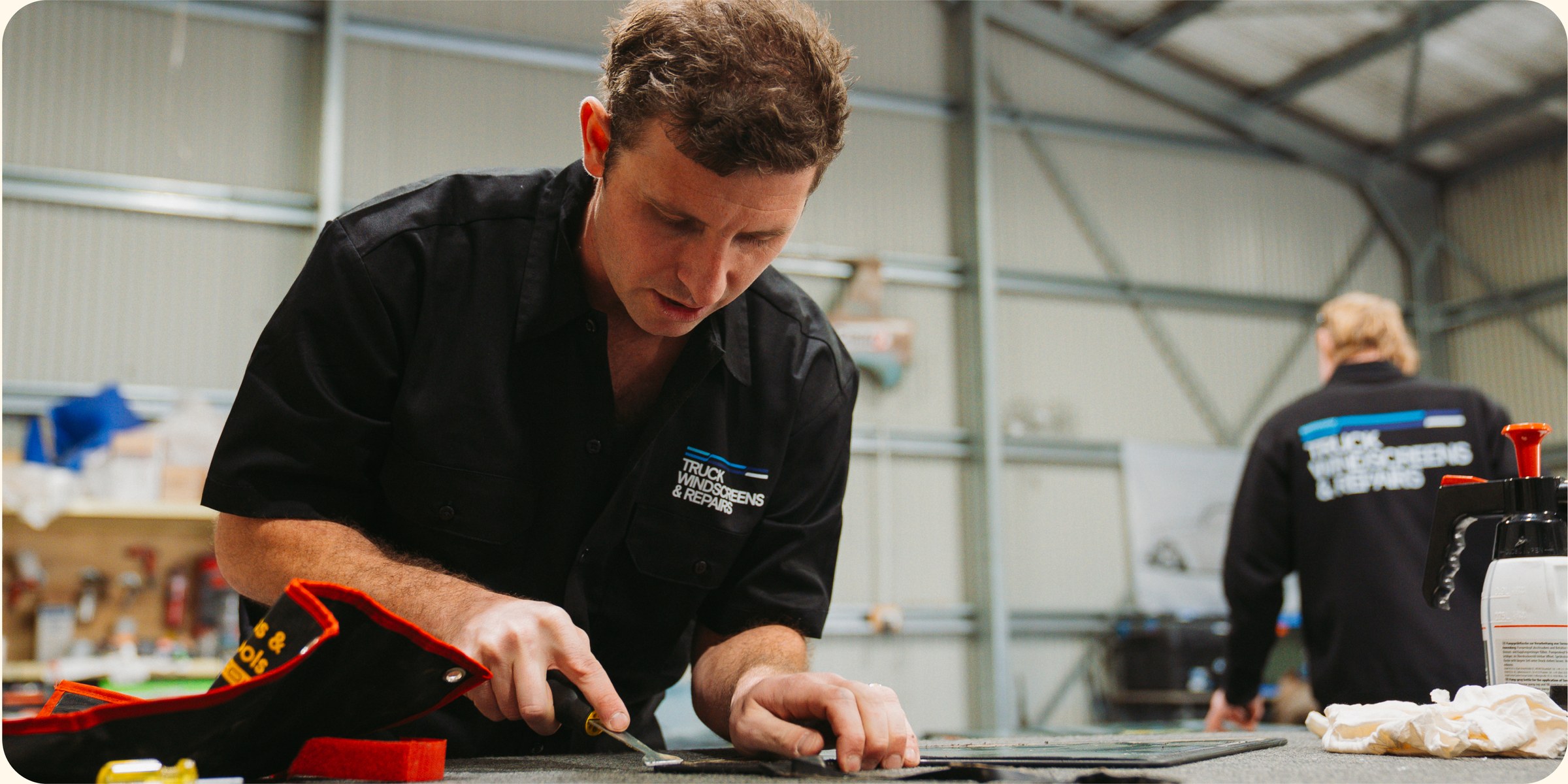Technician working at the glass bench in the workshop